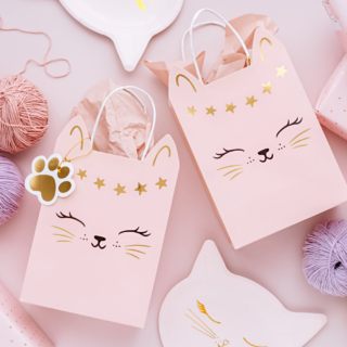 roze cadeautas met een gouden katten gezichtje