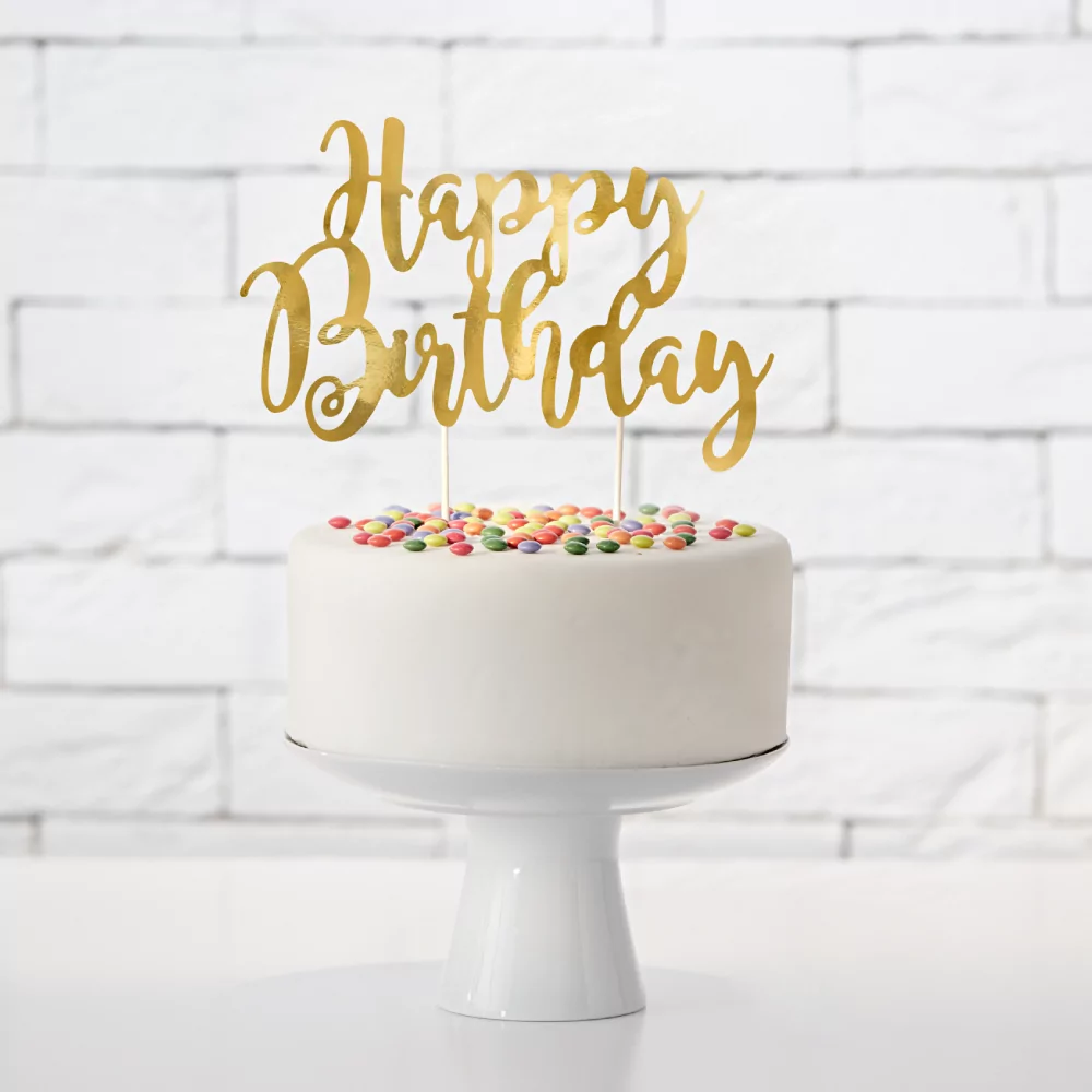 Gouden taart topper met de tekst happy birthday