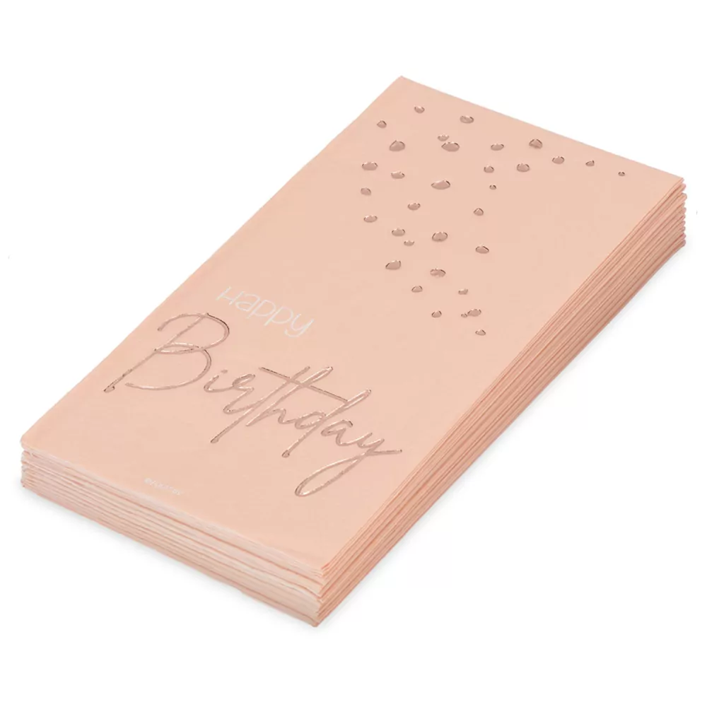 Stapeltje met roze servetten met happy birthday erop