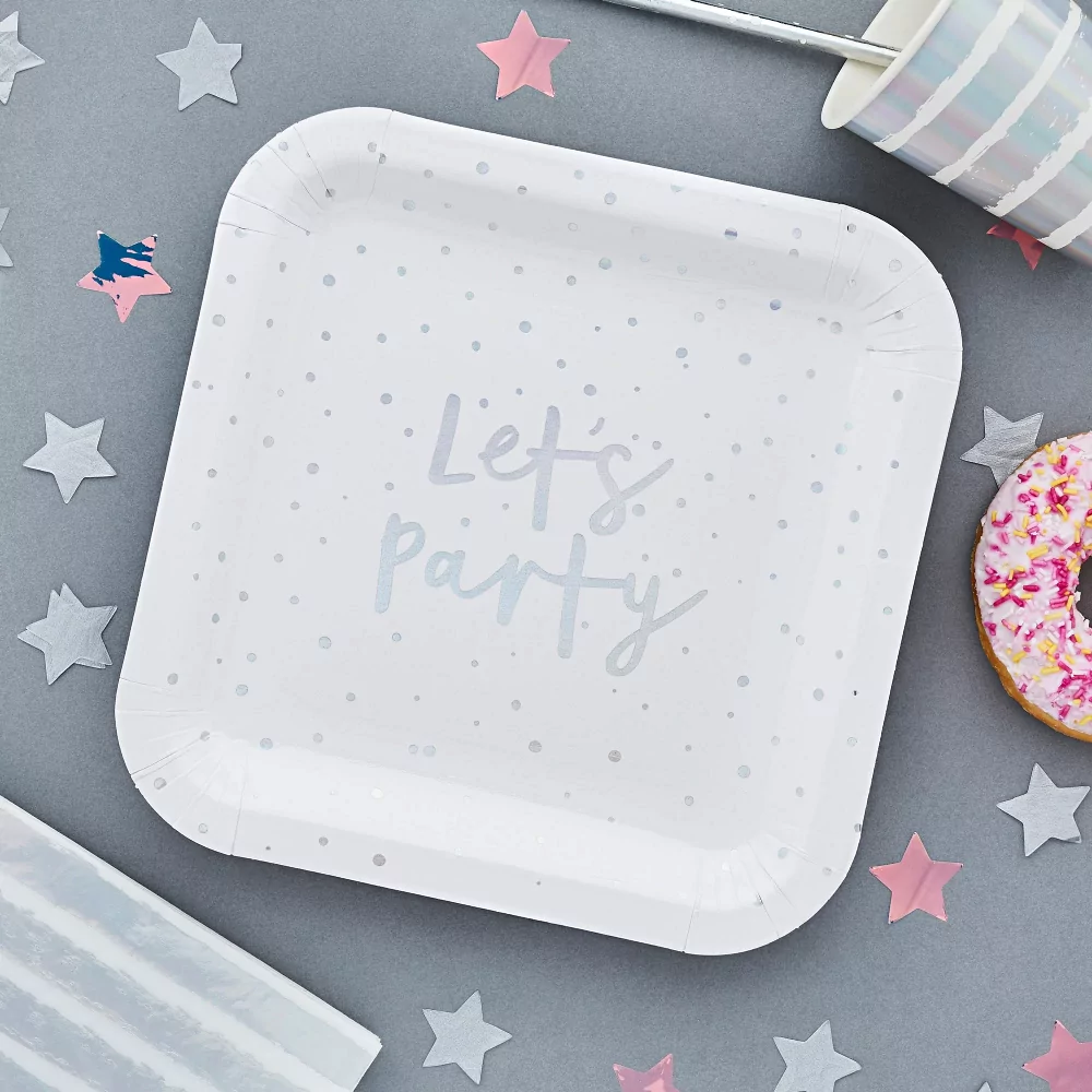 wit met iridescent bordje in het vierkant op een grijze tafel met holografische sterren confetti