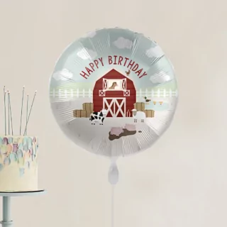 Ballon bedrukt met boerderijdieren zoals een koe, paars en varkens en de tekst happy birthday in het rood